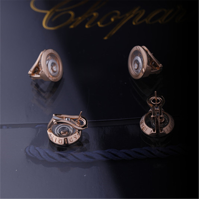 Chopardのダイヤモンドが付いているローズの倫理的な金の倫理的なホワイト ゴールドの幸せな精神のイヤリング
