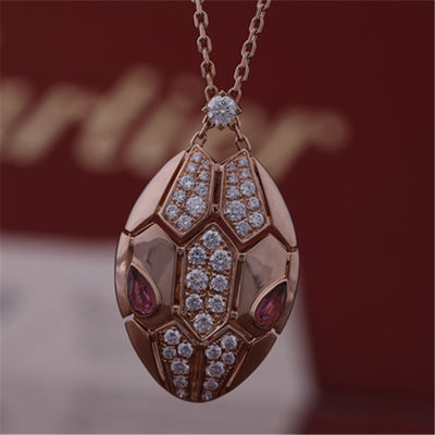品質 18 kt金のSerpentiのローマのネックレスはrubelliteの目と頭部のpavéのダイヤモンドと置かれた上がった 工場